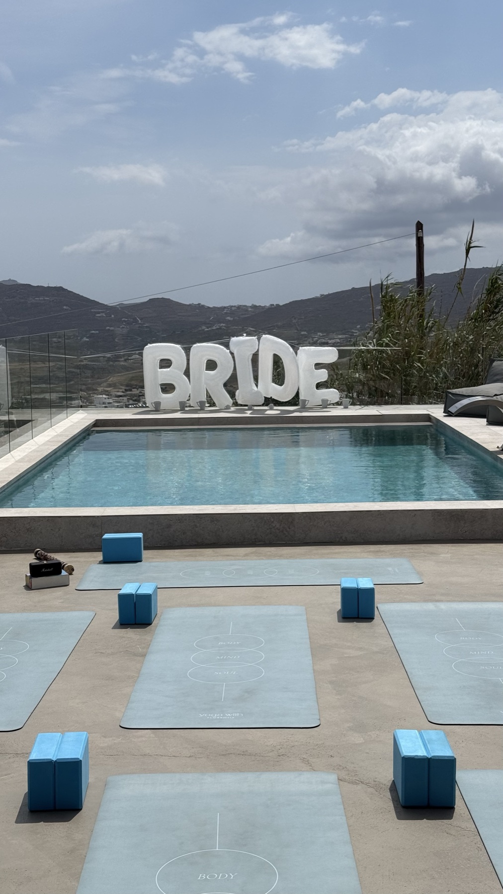 Group of women doing yoga for a bachelorette in Mykonos