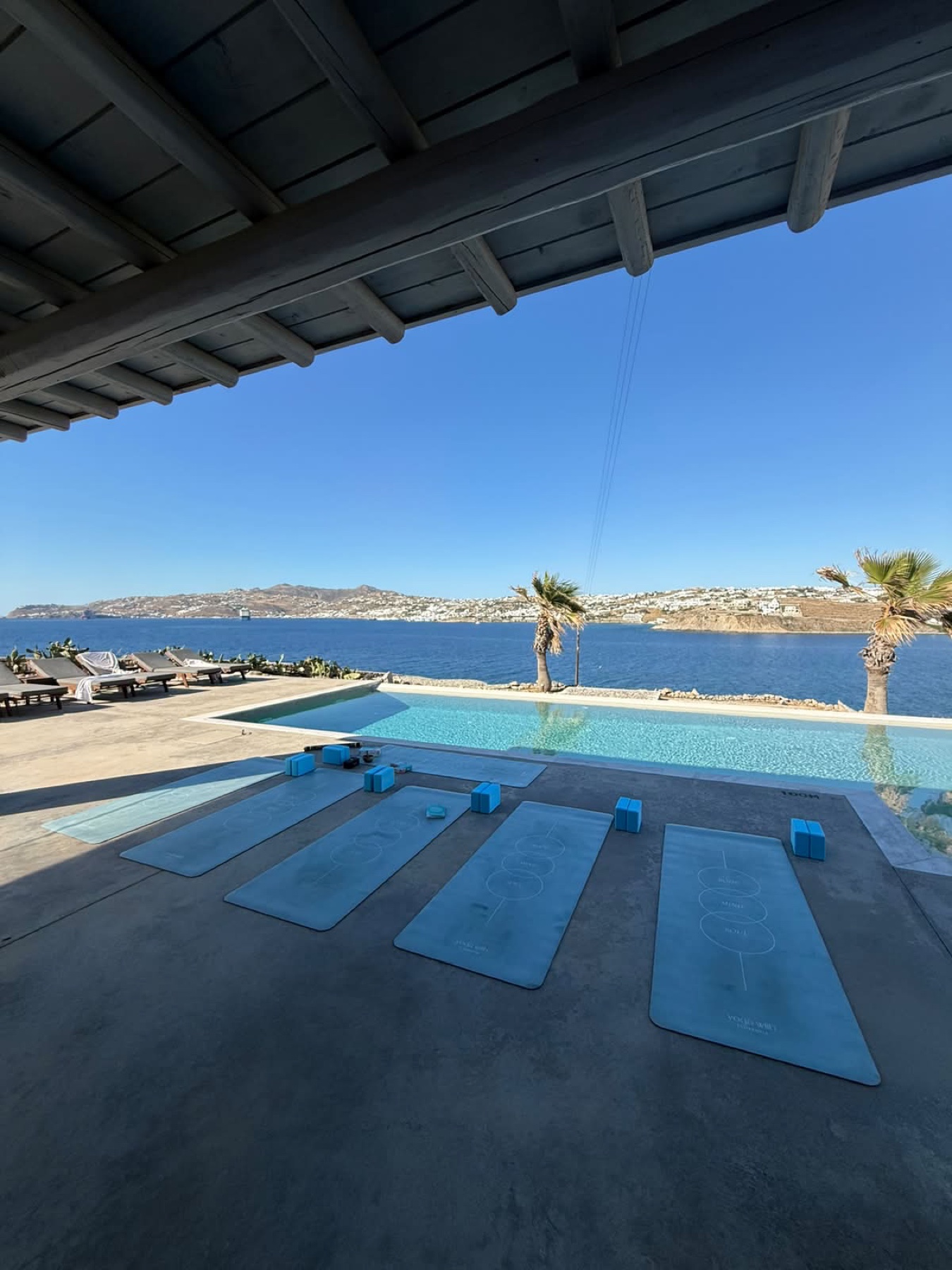 Group yoga before brunch at a Mykonos villa