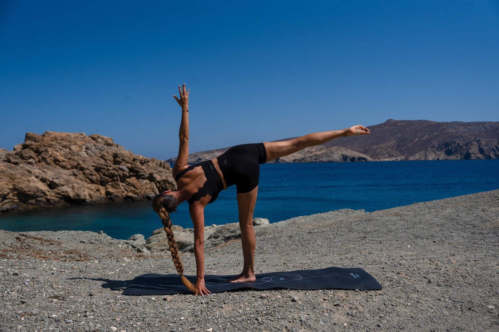 Yoga retreat practice on a quiet coastline in Mykonos